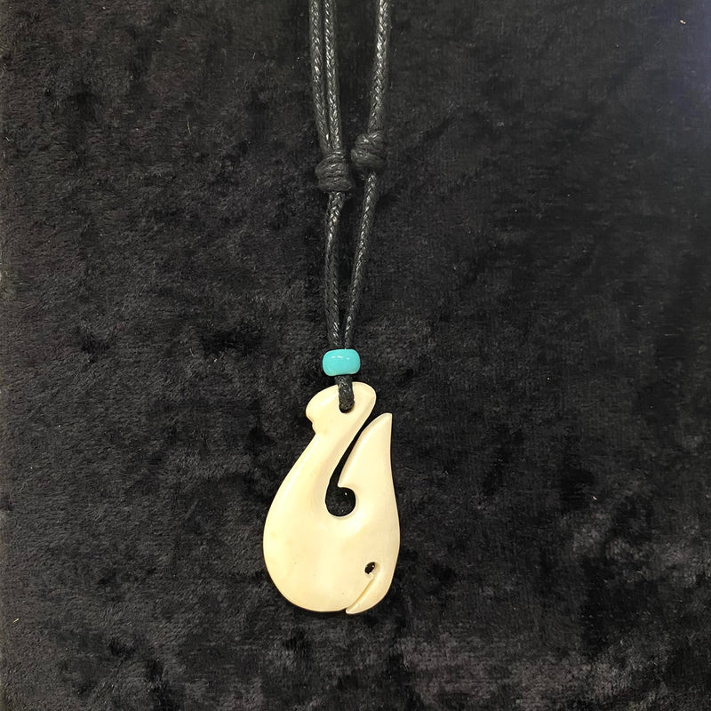 Carved Buffalo Bone Fish Hook with Blue Glass Bead